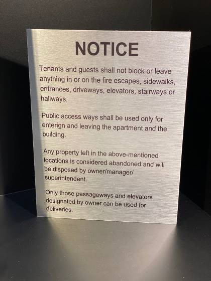 Brushed aluminum Notice sign about fire escapes