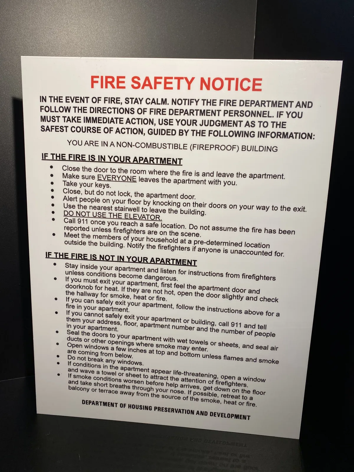 FDNY fire safety notice printed on white aluminum