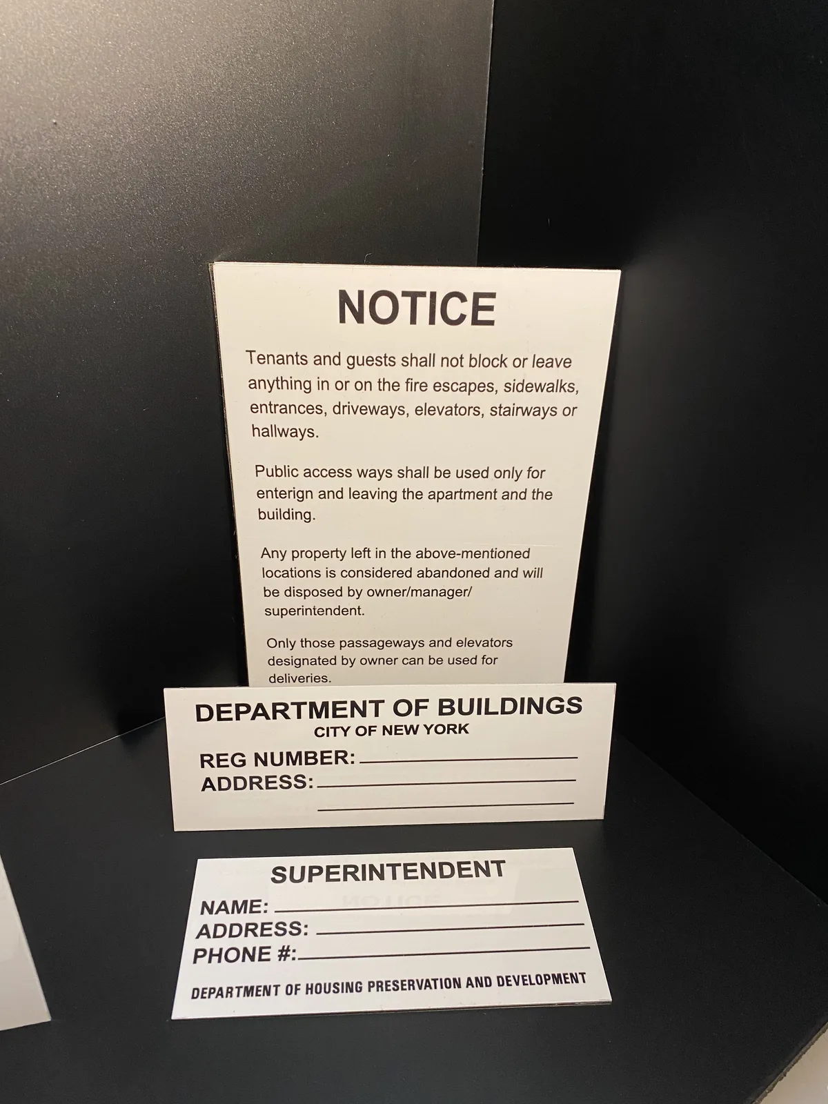 HPD lobby signs: notice, registration number sign and superintendent sign