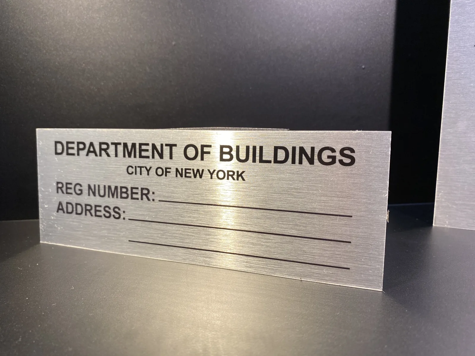 Brushed aluminum Department of Buildings registration number sign